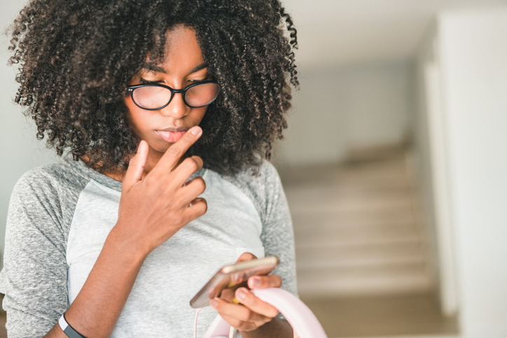 Young woman holding cell phone